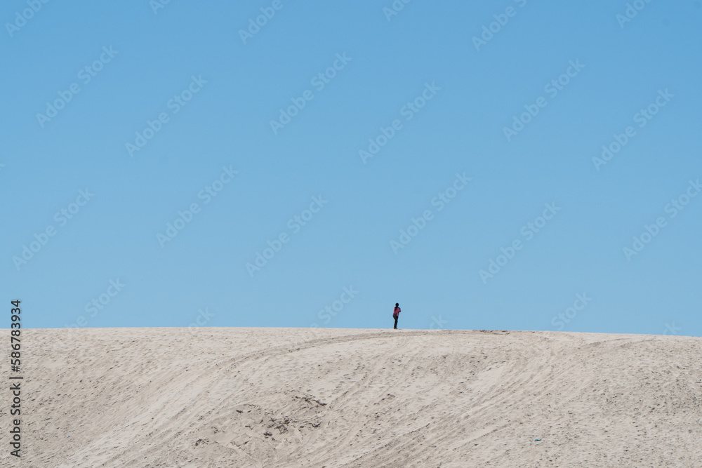 lonely person not visible walking among the desert dunes lonely person not visible walking among the desert dunes