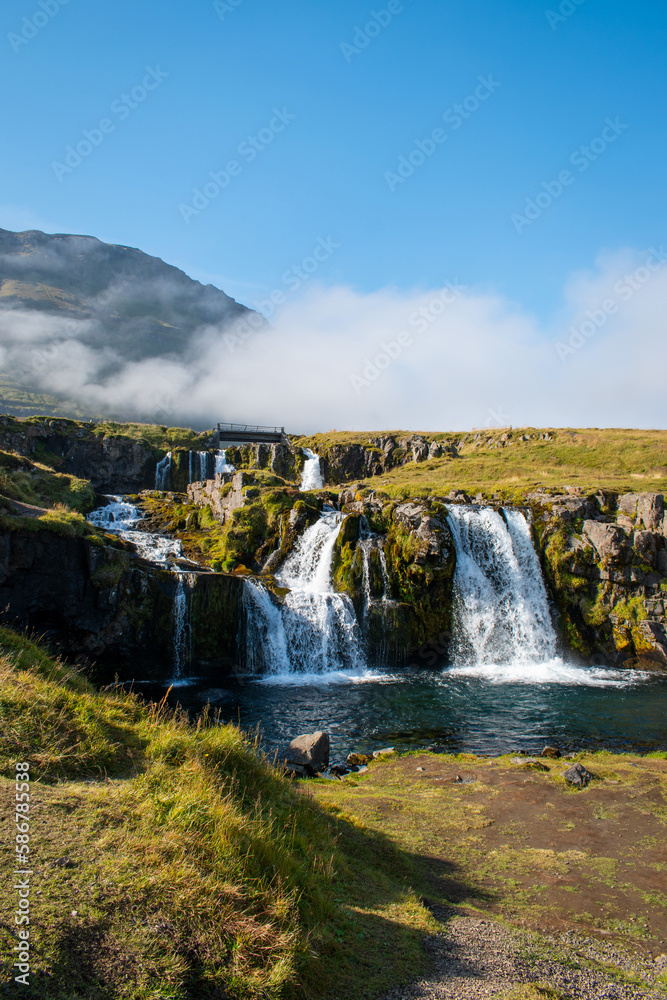 View of Kirkjufellsfoss on a sunny day, Iceland View of Kirkjufellsfoss on a sunny day, Iceland