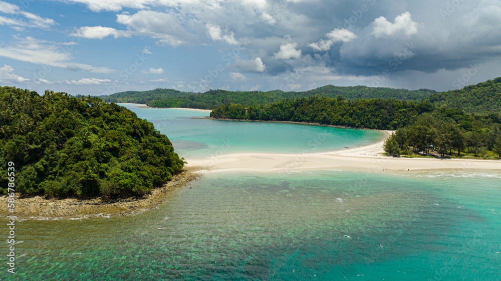 Aerial view of beautiful sandy beach and tropical island. Tropical landscape. Kelambu Beach. Borneo, Malaysia. Aerial view of beautiful sandy beach and tropical island. Tropical landscape. Kelambu Beach. Borneo, Malaysia.