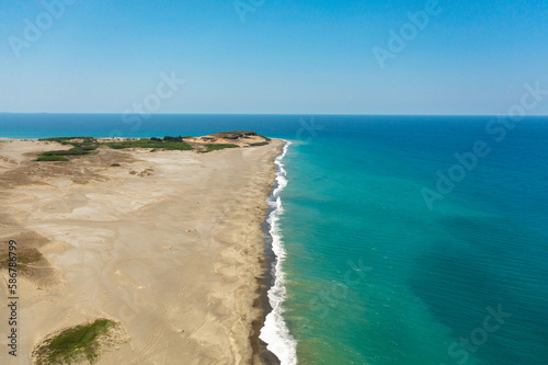 Aerial view of tropical beach and blue sea. Paoay Sand Dunes, Ilocos Norte, Philippines. photo