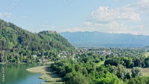 Lake Ossiach is a stunning alpine lake located in the state of Carinthia, Austria, surrounded by the majestic Nock Mountains and offering a range of recreational activities. Aerial view