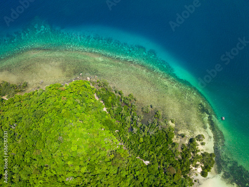 Turquoise lagoon surface on atoll and coral reef, copy space for text. Top view transparent turquoise ocean water surface.
