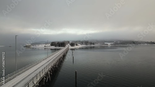 Hakoybrua Bridge connecting Hakoya and Kvaloya Islands, Norway. Aerial forward and sky for copy space photo