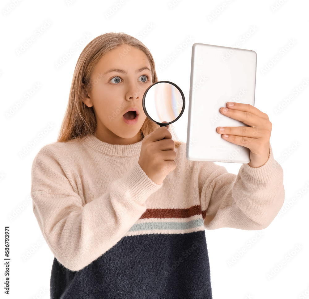 Shocked little girl with magnifier using tablet computer on white background Shocked little girl with magnifier using tablet computer on white background