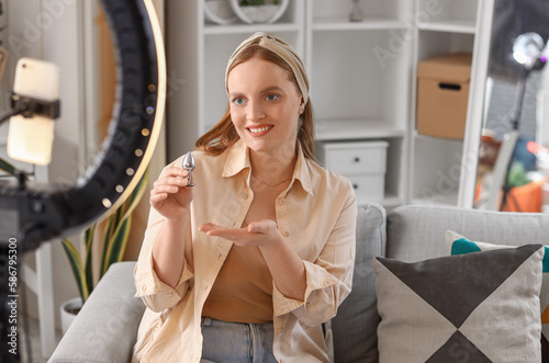 Female blogger making video...