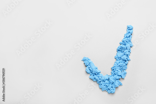 Check mark made of blue cos...