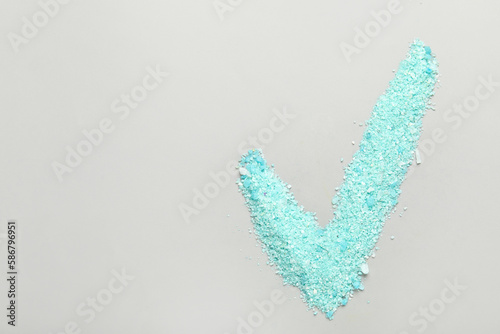 Check mark made of sea salt...