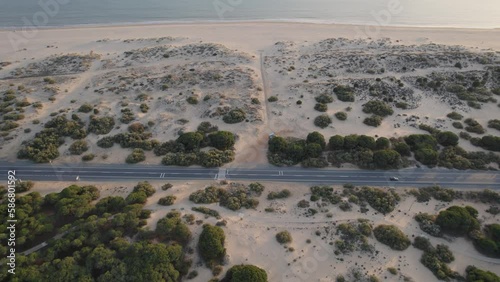 Beach Of Huelva In The Middle Of The Dunes With Sunset Light And An Straigth Road photo