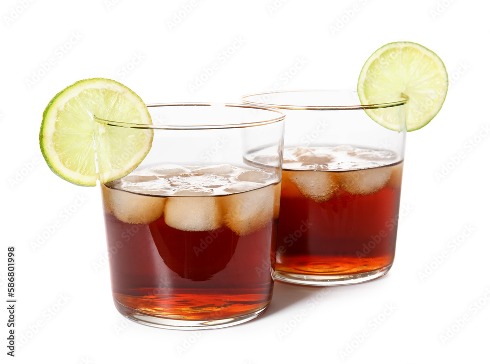 Glasses of cold rum with lime on white background Glasses of cold rum with lime on white background