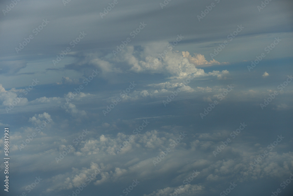 Fluffy white clouds on the blue sky