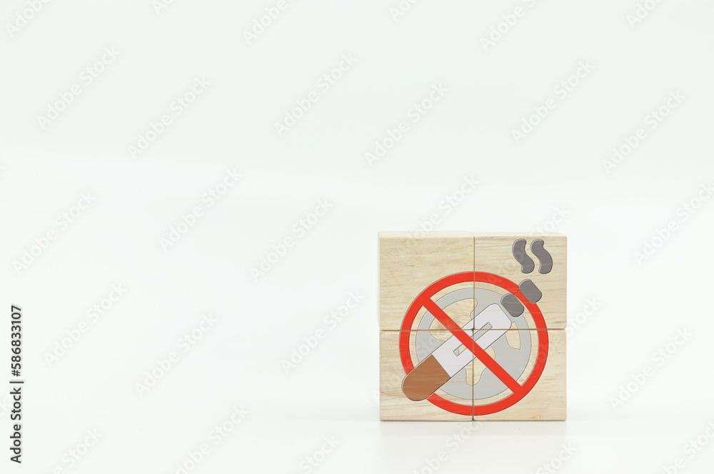Stop smoking icon on wooden cubes with white background. No smoking and World No Tobacco Day