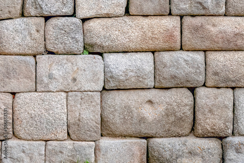 The surface of the ancient masonry of natural stones.