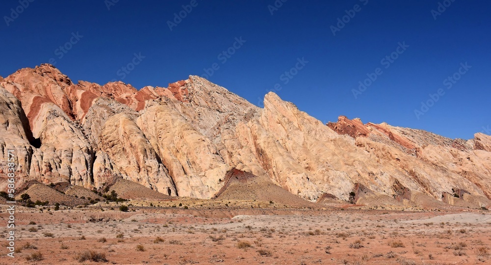 the  colorful flatiron rock formations in the san rafael reef near uneva canyon on a sunny day, near green river, utah