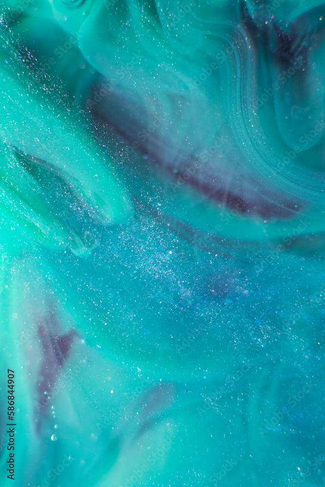 Photo of beautiful mixtures of blue colorful substances in the deep space. Abstract texture of colorful splashes. Expressive swirls.