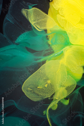 Photo of Beautiful Mixture of Blue and Yellow Colorful Substances in the Deep Space. Abstract Texture of Color Splash. Expressive Swirls.