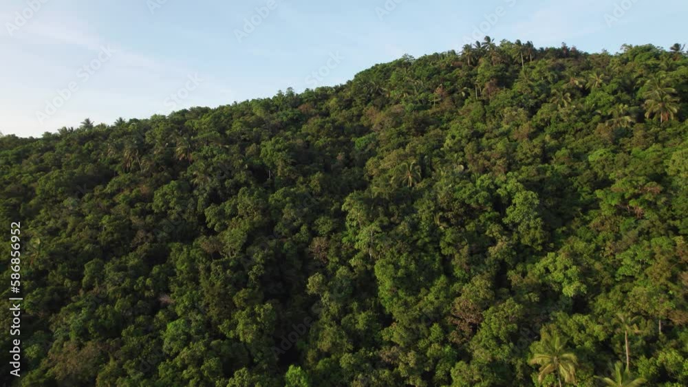 Drone flies towards green mountain top. Samui, Thailand Drone flies towards green mountain top. Samui, Thailand
