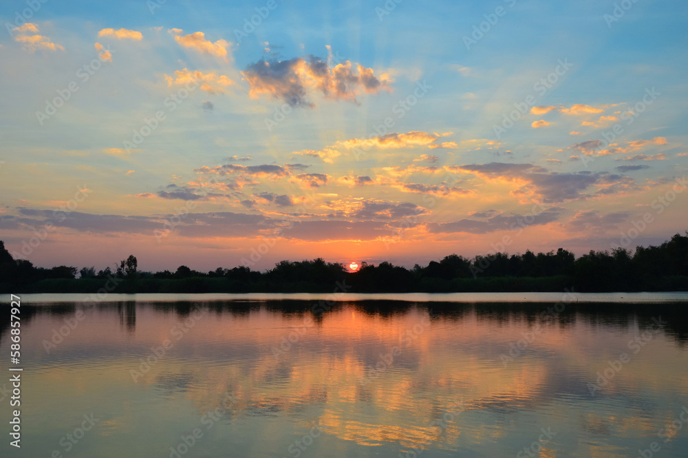 Fototapeta premium Beautiful sunset in the river with reflection