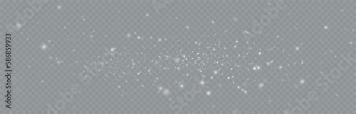 Particles of white magic dust. Shining light particles.Christmas glitter particles. Light effect on a transparent background