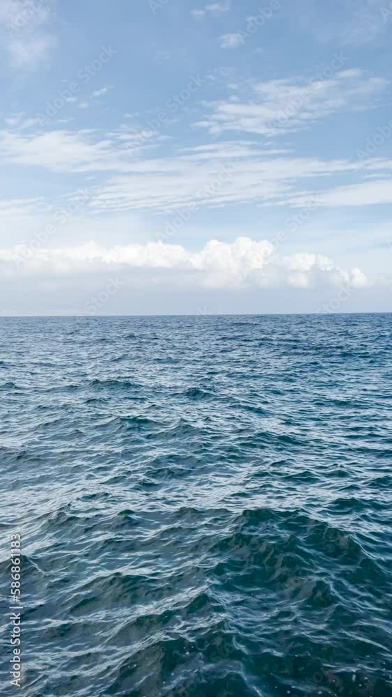 Adriatic sea water surface with dramatic sky in late summer, vertical video Adriatic sea water surface with dramatic sky in late summer, vertical video