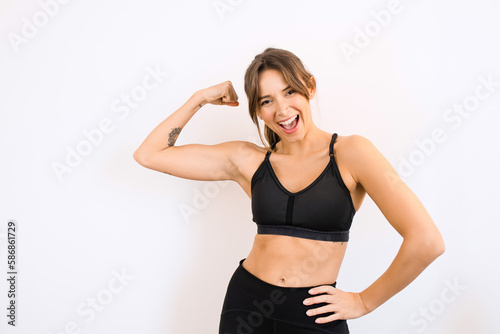 Happy Young Sporty Woman Showing Arm Muscles Fitness Fit Healthy Lifestyle Weight Training Exercises © Lais