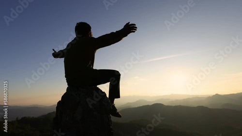  Silhouette of man praying on the background  at sunset. spirituality and religion,man praying to god. Christianity concept, Video 4k slow motion.