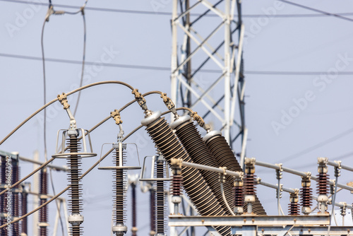 High voltage ceramic insulators on a transformer in Power Substation.