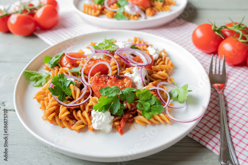 Fitness meal with whole grain pasta, vegetables and high protein cottage cheese on a plate