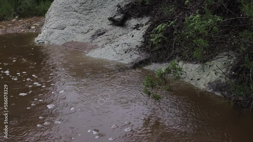 creek in vasquez rock natural area during california flooding in agua dulce SLO-MO photo