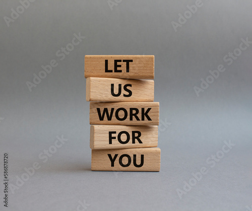 Let us work for you symbol. Wooden blocks with words Let us work for you. Beautiful grey background. Business and Let us work for you concept. Copy space.