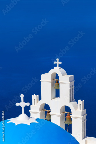 Santorini, Greece panoramic view with white Greek orthodox church and blue sea in Oia