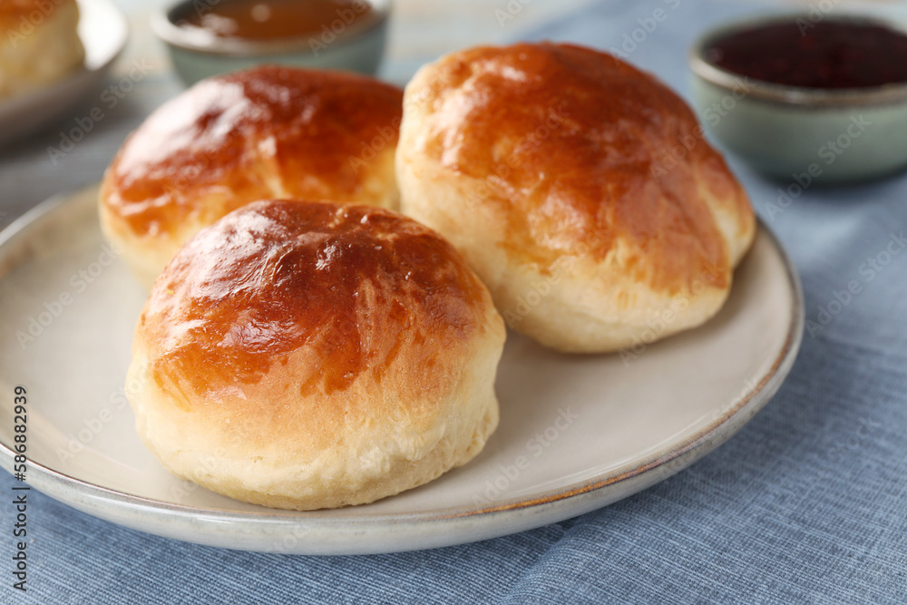 Tasty scones prepared on soda water on table, closeup Tasty scones prepared on soda water on table, closeup