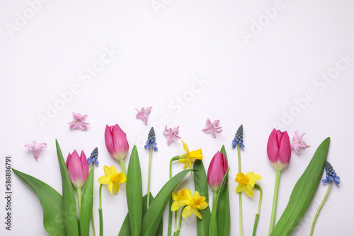 Fototapeta Naklejka Na Ścianę i Meble -  Beautiful flowers on white background, flat lay. Space for text