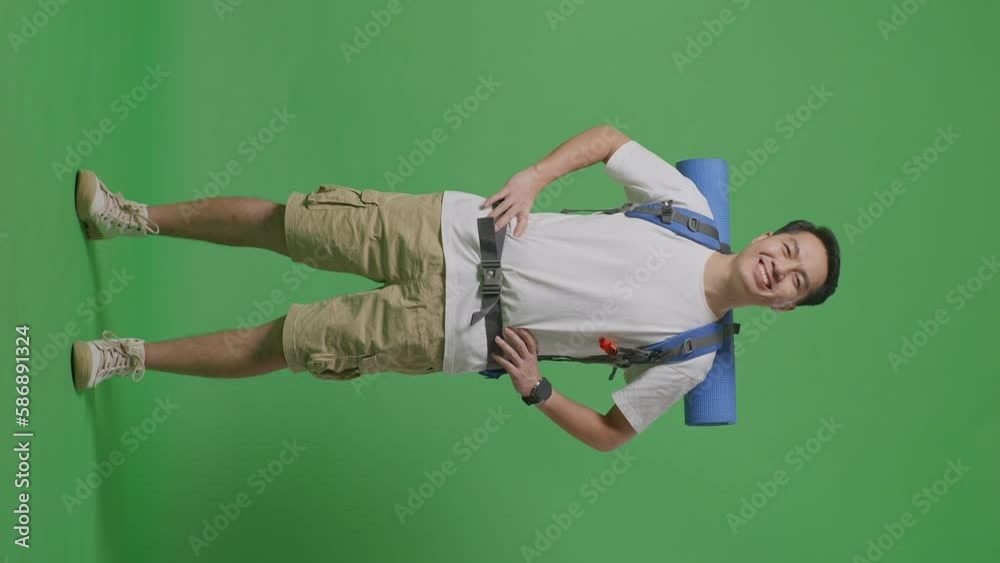 Full Body Of Asian Male Hiker With Mountaineering Backpack Smiling And Posing Arms Akimbo While Standing On Green Screen Background In The Studio
Full Body Of Asian Male Hiker With Mountaineering Backpack Smiling And Posing Arms Akimbo While Standing On Green Screen Background In The Studio