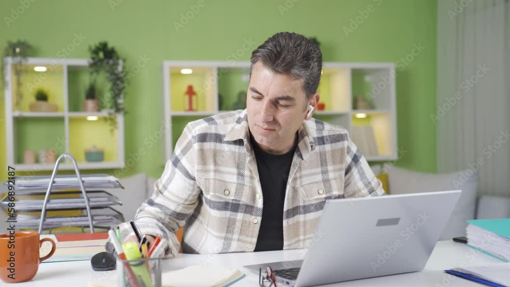 Home office worker working under time pressure.
Home office worker looking at his watch gets flustered and panics.
Home office worker working under time pressure.
Home office worker looking at his watch gets flustered and panics.