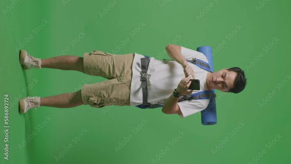 Full Body Of Asian Male Hiker With Mountaineering Backpack Looking At The Smartphone And Screaming Goal Celebrating The Success While Standing On Green Screen Background In The Studio
Full Body Of Asian Male Hiker With Mountaineering Backpack Looking At The Smartphone And Screaming Goal Celebrating The Success While Standing On Green Screen Background In The Studio
