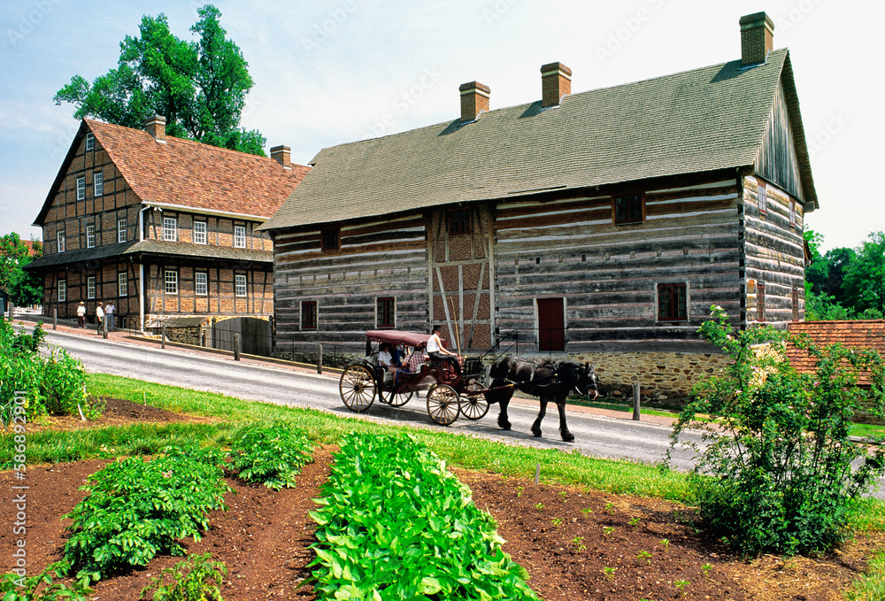 Moravian religious community of Old Salem. Winston Salem, N. Carolina, USA. Buggy passes the Single Brothers House