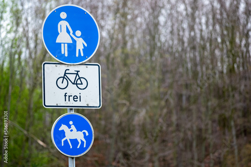 3 traffic signs for horses, children, bicycles