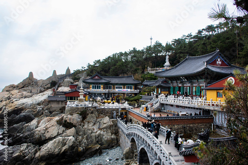 View landscape along coastline and Haedong Yonggungsa temple for korean people travelers travel visit respect praying blessing wish buddha at Gijang on February 18, 2023 in Busan or Pusan, South Korea photo