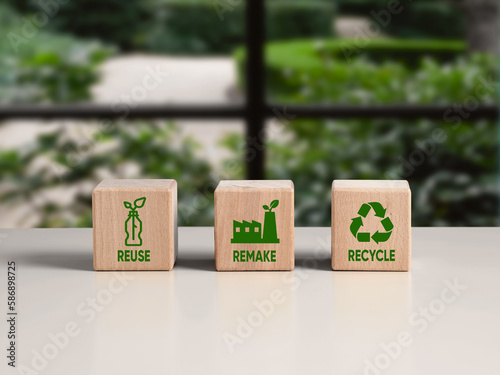 Circular economy. Sustainable strategy approach to eliminate waste and pollution for business and environment, Wooden cubes with the words reuse, remake and recycle and symbols. photo