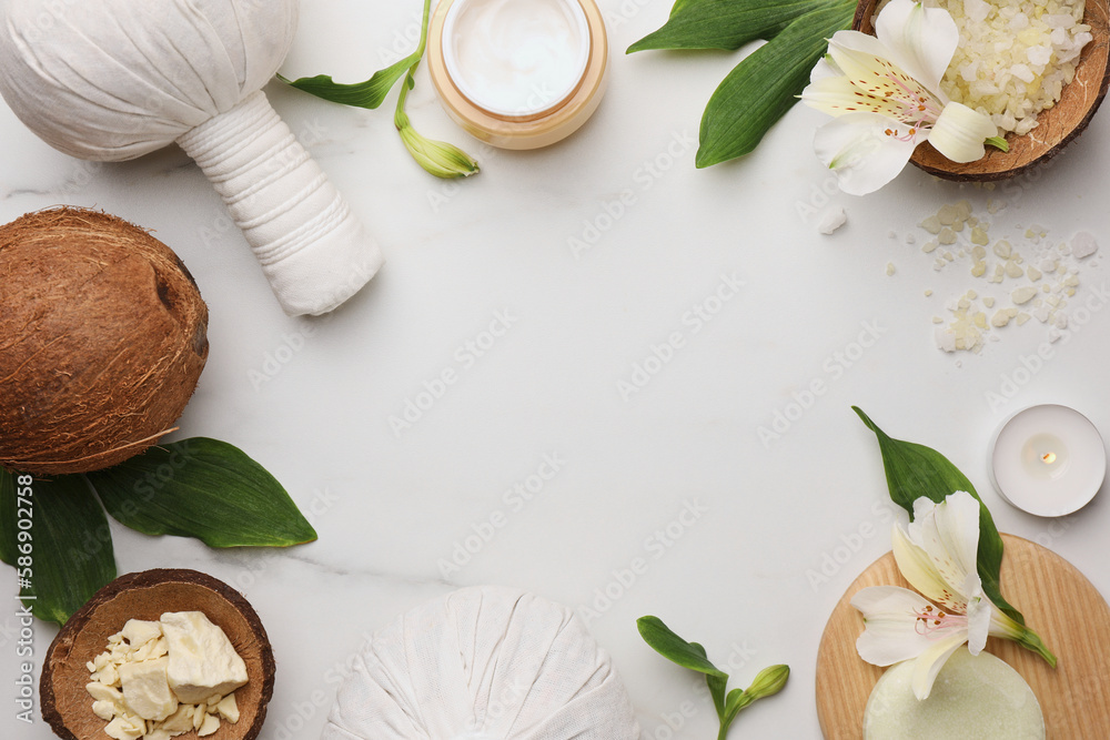 Frame made of different cosmetic products on white marble table, flat lay and space for text. Spa composition Frame made of different cosmetic products on white marble table, flat lay and space for text. Spa composition