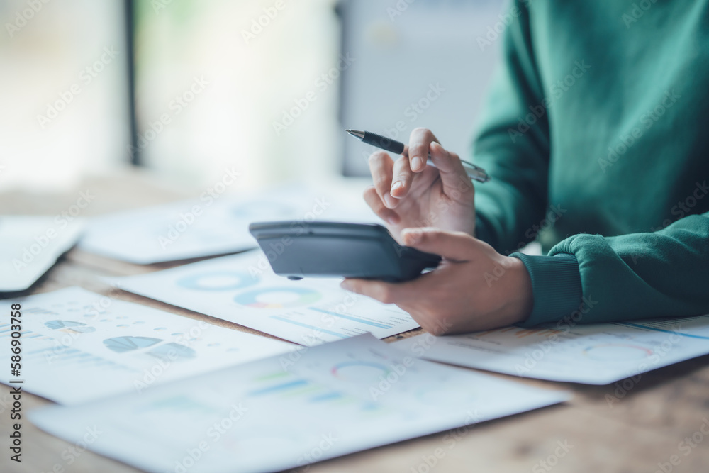 Fototapeta premium Financial Businesswomen analyze the graph of the company's performance to create profits and growth, Market research reports and income statistics, Financial and Accounting concept.