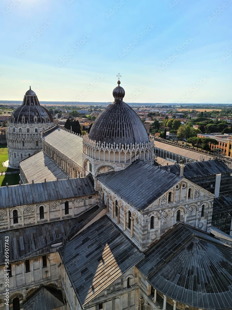 2022.07.15 Italy, Pisa Cathedral of Santa Maria Assunta in Piazza dei Miracoli,
evocative image of the back of the Cathedral seen from the top
of the tower of Pisa under a clear sky