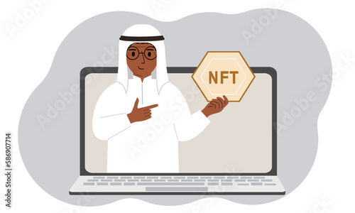 NFT concept. A laptop in which a muslim man with the image of NFT in the palm of his hand. Auction of non-fungible tokens, markets, online education.