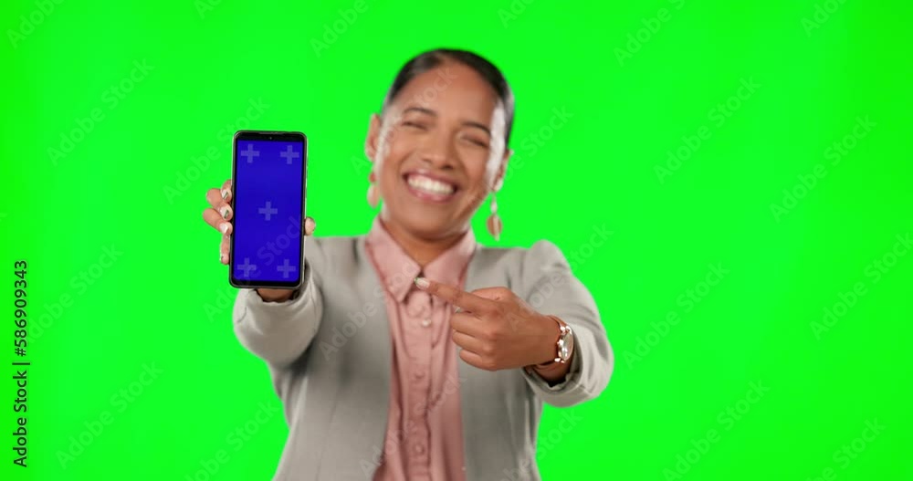 Portrait, green screen and a business woman pointing to a phone with tracking markers for marketing. Social media, ecommerce and chromakey with an female employee showing a mobile screen or display Portrait, green screen and a business woman pointing to a phone with tracking markers for marketing. Social media, ecommerce and chromakey with an female employee showing a mobile screen or display