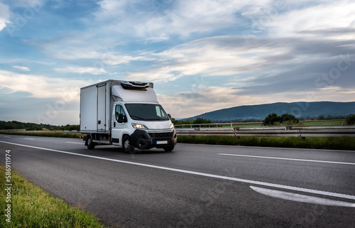 White cargo van at the interurban road