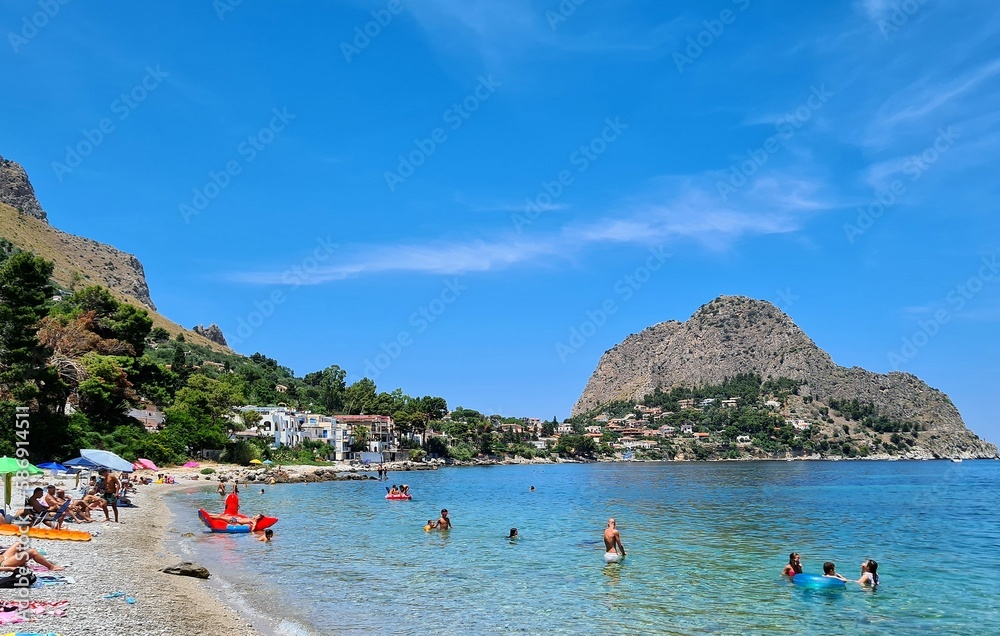 Obraz premium evocative image of a sandy beach in Sicily in summer under a beautiful blue sky 