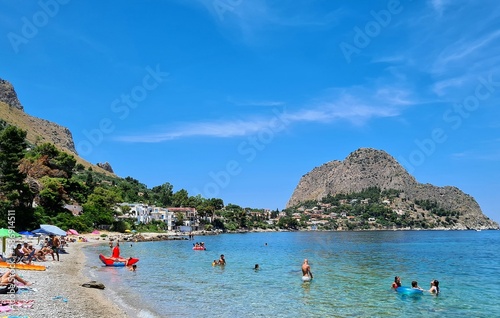 evocative image of a sandy beach in Sicily in summer under a beautiful blue sky 