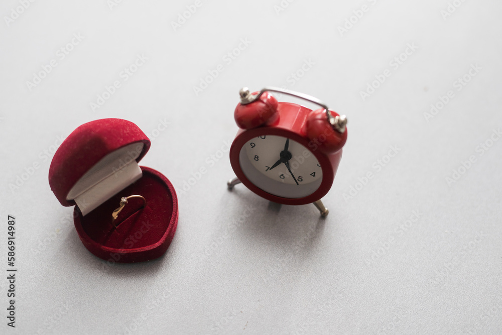 Wedding rings and alarm clock, wedding time concept. Wedding rings and alarm clock, wedding time concept.