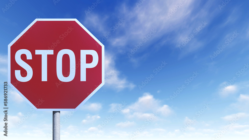 Close up shot of a red stop sign on a blue sky background. Copy space for text.