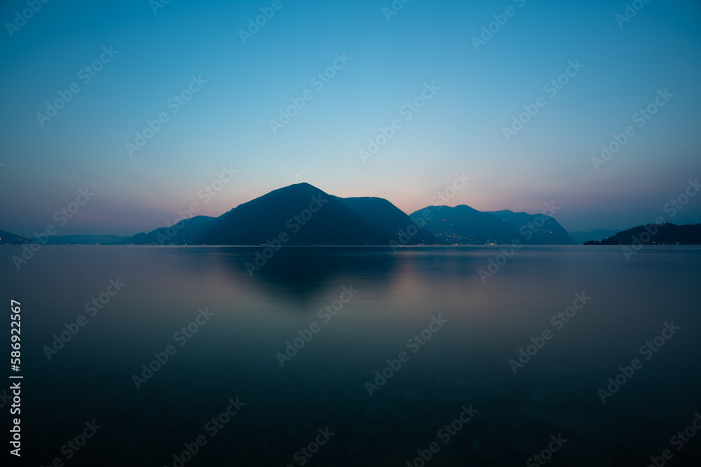 sea and mountains, sunset at a lake